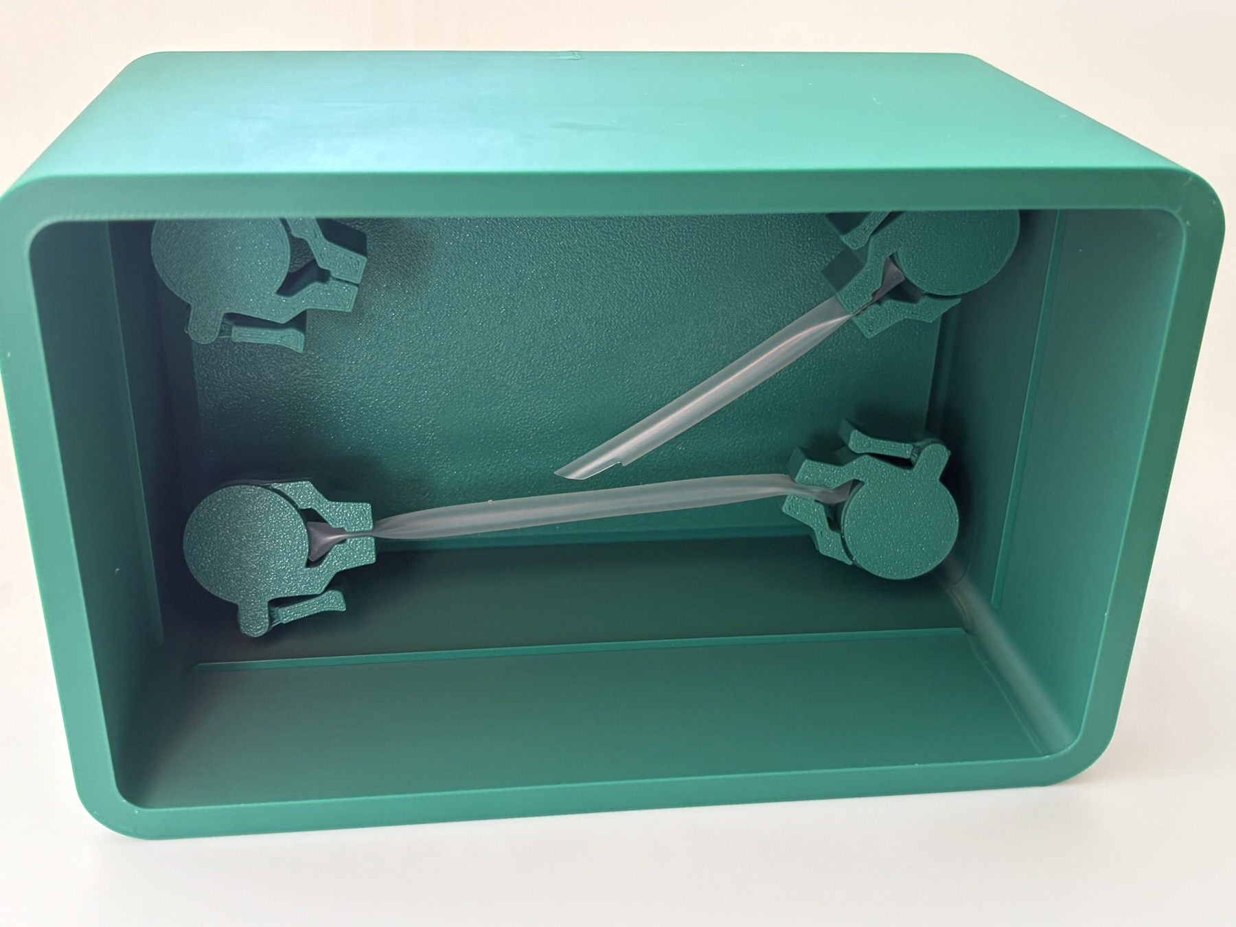 The case arranged horizontally, creating a deep enclosure for a side-on approach to the simulated vessels.