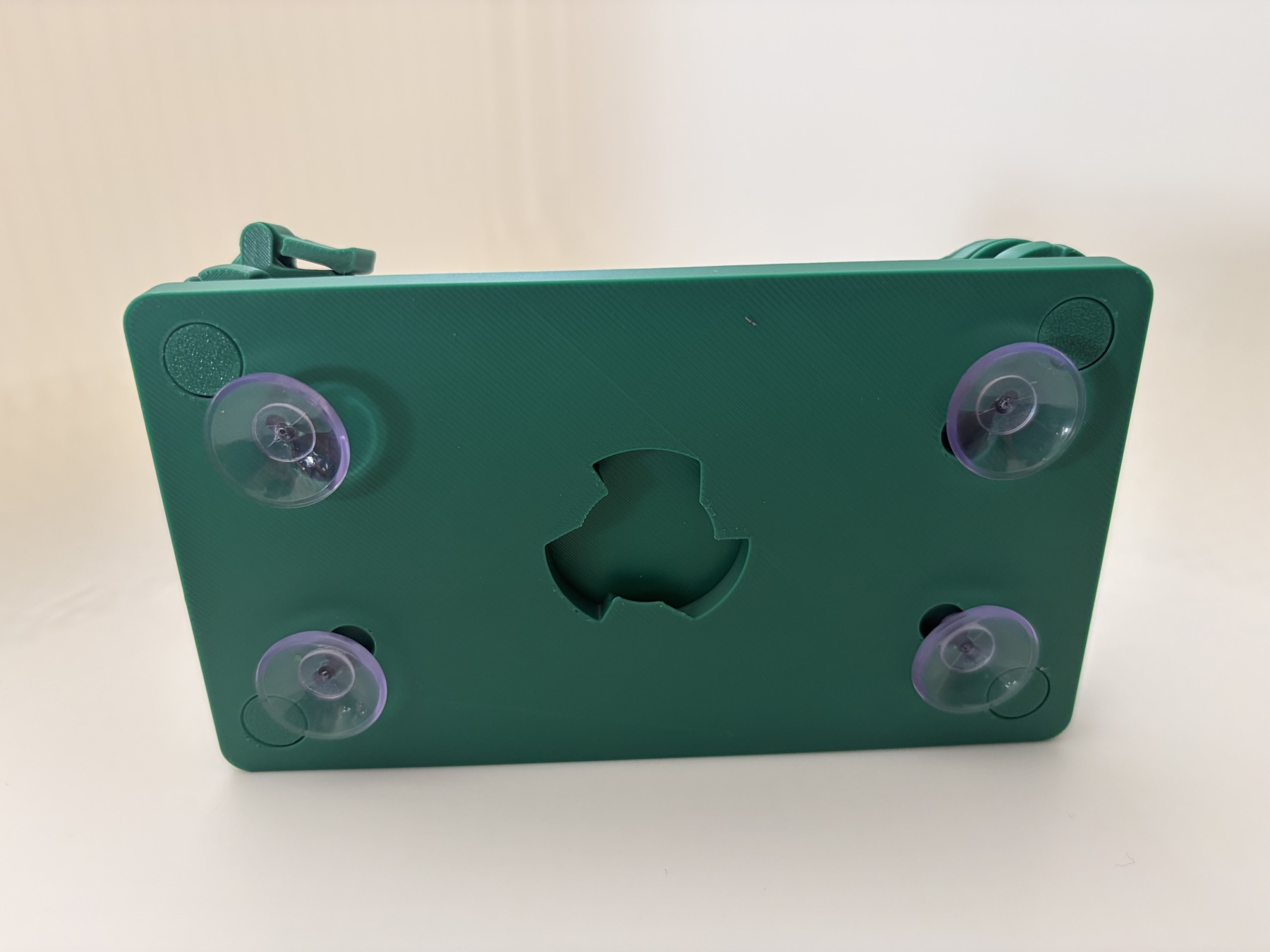 Four suction cups fitted to the underside of the simulator case.