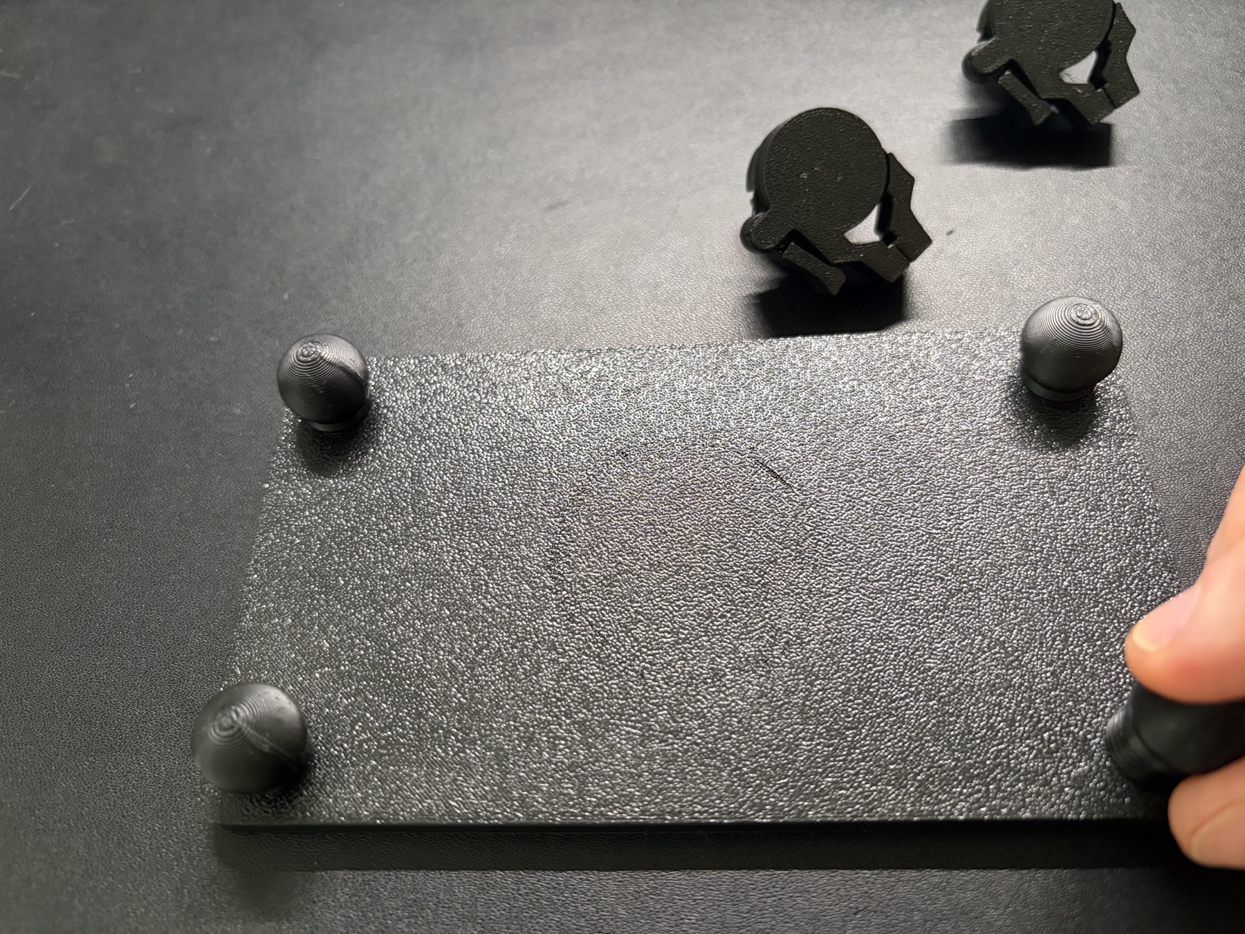 The jig with ball joints fitted at its four corners.